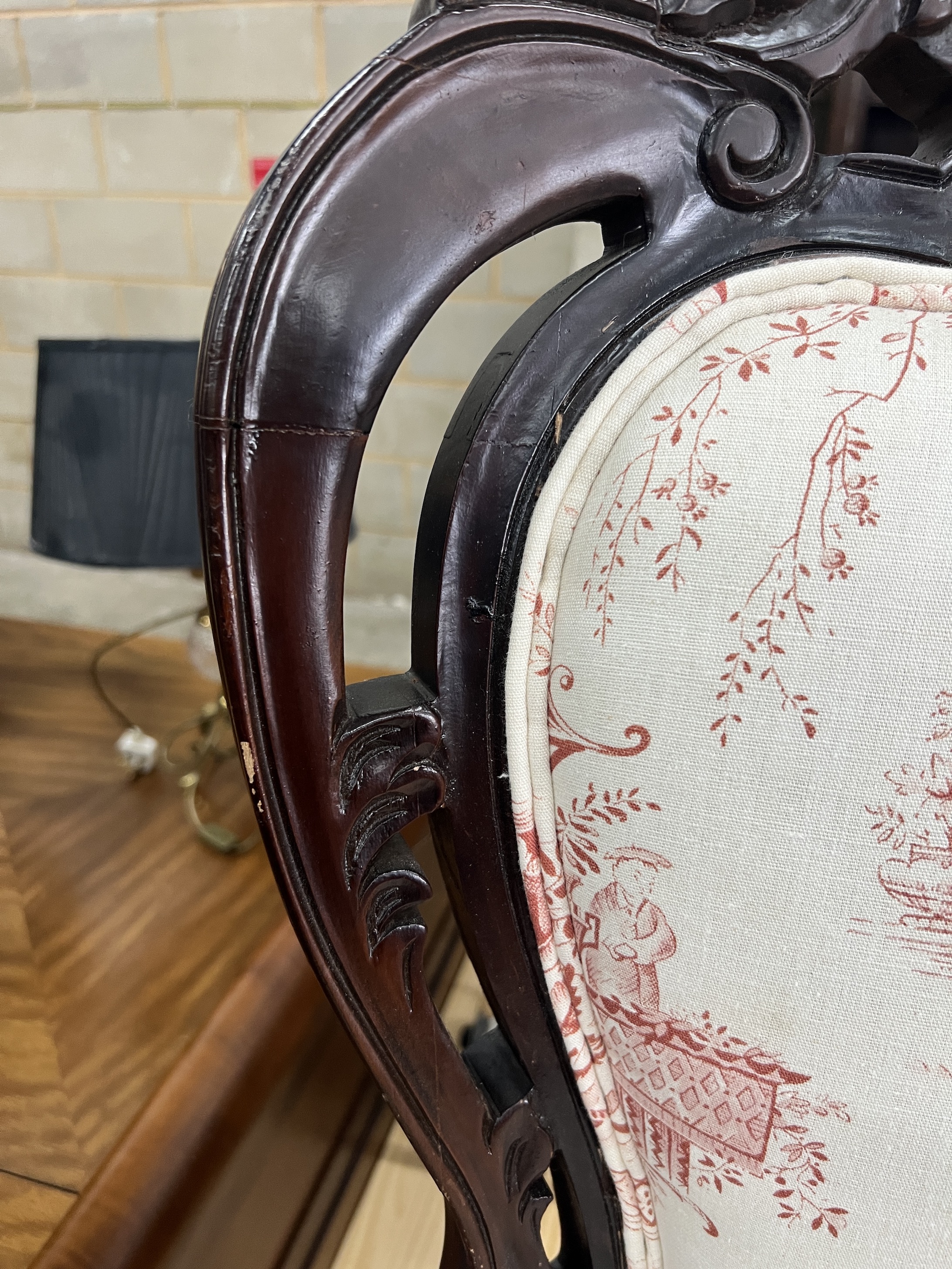 A French carved mahogany upholstered elbow chair, width 69cm, depth 54cm, height 114cm